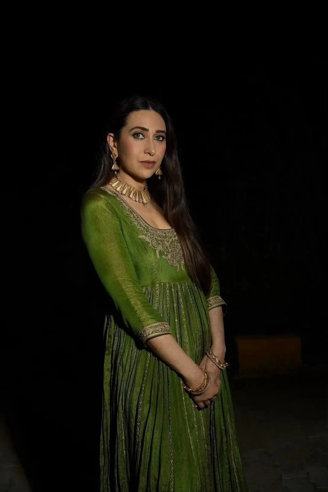 Karisma Kapoor in pickle-green 64-kali Anarkali by Punit Balana for Moh collection